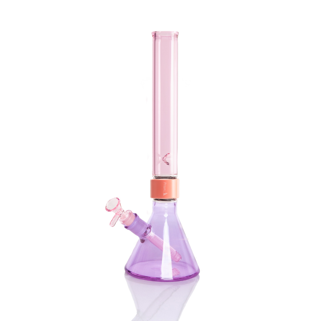 Prism MINI Duo Tall Beaker Single Stack in Grape Jolly Rancher and Pink Lemonade. A compact modular glass bong featuring a 5mm thick borosilicate beaker base in translucent Grape Jolly Rancher purple, a coral anodized aluminum MINI Halo connector, and a MIIN translucent Pink Lemonade tall mouthpiece. Includes matching Pink Lemonade glass MINI downstem and 14mm bowl.