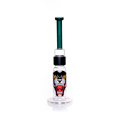 Back view of the Prism honeycomb glass water pipe featuring a large, central panther graphic on the base. The illustration is a vibrant tattoo-style design that wraps the thick borosilicate honeycomb pipe. Image highlights the dual-disc filtration system and the connection between the black anodized aluminum fitting and the bent teal top section. Includes the clear 18mm slide joint for a dry herb accessory. Customizable easy clean water pipe for collectors.