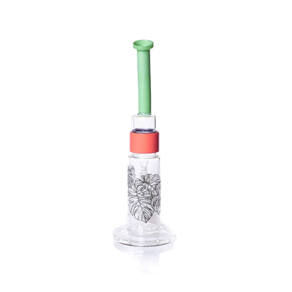 Glass water pipe with a green top and red base on a white background
