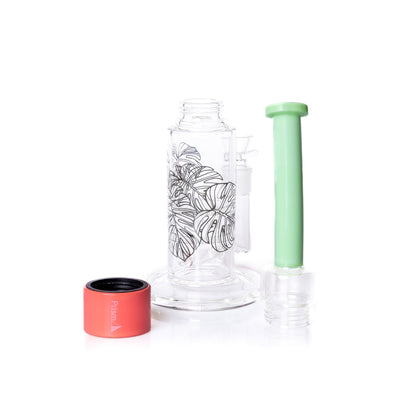 Clear glass pipe with black leaf design, green cap, and pink base on a white background